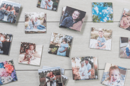 Magnets scattered on wooden backdrop